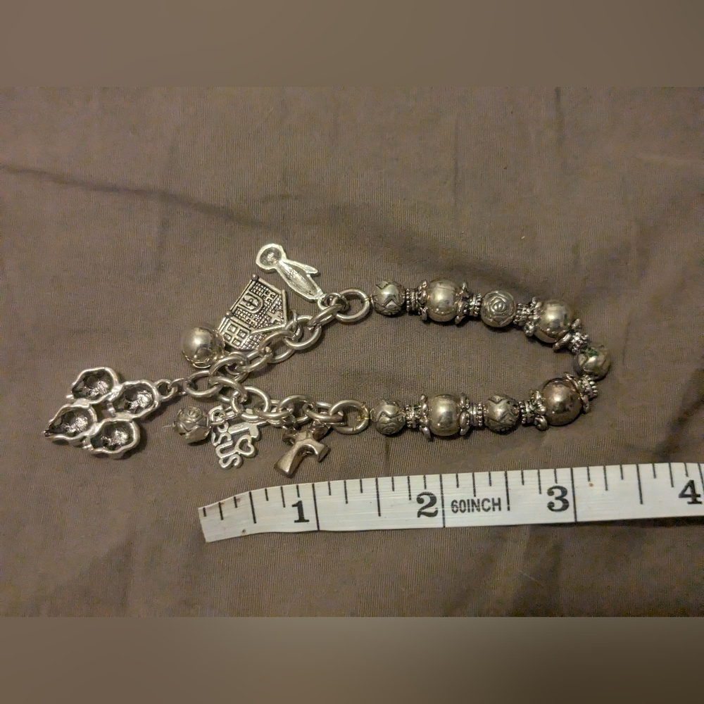 Unique charm bracelet with religious icons